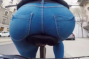 sexy round ass tight jeans bicycle in public city